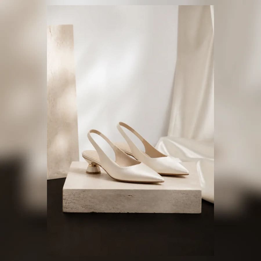 Colette Satin Slingback Pumps — close craftsmanship view showing construction and finish